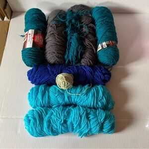 Lot of mixed yarn. Teal, light blue, dark blue, grey, and pastel green